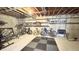 Unfinished basement with painted walls, gym equipment, and storage shelves with various items at 3724 Jonathan Rdg, Columbus, IN 47201