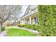 Two-story home showcasing meticulous landscaping, a brick facade, a covered porch, and a well-manicured lawn at 3724 Jonathan Rdg, Columbus, IN 47201