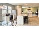 Open floor plan with kitchen and living room, stainless steel appliances, and island seating at 3724 Jonathan Rdg, Columbus, IN 47201