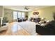 Spacious living room with hardwood floors, a cozy fireplace, comfortable seating, and ample natural light at 3724 Jonathan Rdg, Columbus, IN 47201
