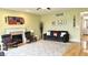 Spacious living room with hardwood floors, a cozy fireplace, comfortable seating, and ample natural light at 3724 Jonathan Rdg, Columbus, IN 47201