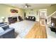 Comfortable living room with a fireplace, ceiling fan, and hardwood flooring at 3724 Jonathan Rdg, Columbus, IN 47201