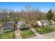 Birds-eye view displaying the arrangement of multiple houses on the block with tree-lined streets and blue skies at 3845 E 32Nd St, Indianapolis, IN 46218