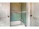 This bathroom features a dated tub with damaged walls and peeling paint, needing renovation at 3845 E 32Nd St, Indianapolis, IN 46218