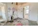 Damaged bedroom needing renovation with peeling paint, damaged walls, and missing floor tiles at 3845 E 32Nd St, Indianapolis, IN 46218