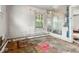 This bedroom is in poor condition with peeling paint, damaged walls, and missing flooring at 3845 E 32Nd St, Indianapolis, IN 46218