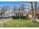 Charming single-story home featuring a well-maintained lawn and mature landscaping in a quiet neighborhood at 3845 E 32Nd St, Indianapolis, IN 46218