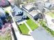Aerial view showcasing the property's layout, manicured lawn, patio, garage, and surrounding neighborhood at 402 E 46Th St, Indianapolis, IN 46205
