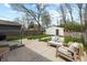 Backyard patio with an outdoor seating area, fire pit, grassy yard, and a detached garage at 402 E 46Th St, Indianapolis, IN 46205