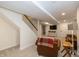 Finished basement includes carpet, stairs, an upholstered chair and built-in shelving at 402 E 46Th St, Indianapolis, IN 46205