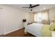 Bedroom featuring wood floors, ceiling fan, natural light, and minimalist decor at 402 E 46Th St, Indianapolis, IN 46205