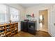 Laundry room featuring modern washer and dryer, wood floors, and natural light at 402 E 46Th St, Indianapolis, IN 46205