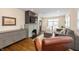 Bright living room with fireplace, built-in shelving, hardwood floors, and ample seating at 402 E 46Th St, Indianapolis, IN 46205