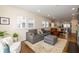 Open living area with a sofa, sitting chair, ottoman and large windows at 402 E 46Th St, Indianapolis, IN 46205