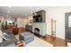 Spacious living room with modern fireplace, hardwood floors, and lots of light at 402 E 46Th St, Indianapolis, IN 46205