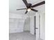 Bedroom with neutral carpet, a ceiling fan, built-in shelves and storage and white trim at 402 N 19Th Ave, Beech Grove, IN 46107