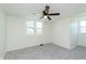 Bedroom with carpet, large windows, and ceiling fan at 402 N 19Th Ave, Beech Grove, IN 46107