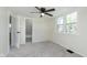Bedroom featuring carpet, a ceiling fan, and two windows at 402 N 19Th Ave, Beech Grove, IN 46107