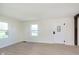 Inviting living room with new flooring, fresh paint, and bright windows overlooking the front yard at 402 N 19Th Ave, Beech Grove, IN 46107