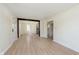 Spacious living room showcasing new flooring and an open layout to the kitchen and dining area at 402 N 19Th Ave, Beech Grove, IN 46107