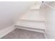 Angled room with shelves and carpet at 402 N 19Th Ave, Beech Grove, IN 46107