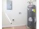 Utility room features a modern water heater, electrical box, and updated plumbing at 402 N 19Th Ave, Beech Grove, IN 46107