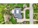 Eye-level aerial shot exhibits lush landscaping, and a private driveway adding allure to this exquisite estate at 4339 Royal Pine Blvd, Indianapolis, IN 46250