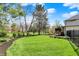 Spacious backyard featuring an expansive lawn and mature trees at 4339 Royal Pine Blvd, Indianapolis, IN 46250
