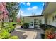Lovely backyard patio with lush greenery and access to the sunroom, creating a serene outdoor retreat at 4339 Royal Pine Blvd, Indianapolis, IN 46250