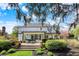 Landscaped backyard and patio with outdoor seating and views of the white two-story home at 4339 Royal Pine Blvd, Indianapolis, IN 46250
