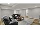 Finished basement with a comfortable seating area with couch, love seat and coffee table on patterned rug at 4339 Royal Pine Blvd, Indianapolis, IN 46250