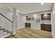 Finished basement bar area featuring custom wine racks, cabinetry, backsplash and a mini-refrigerator at 4339 Royal Pine Blvd, Indianapolis, IN 46250