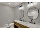 Bathroom features double sinks, modern lighting, and sleek countertops at 4339 Royal Pine Blvd, Indianapolis, IN 46250