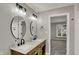 Bathroom features double sinks, modern lighting, and sleek countertops at 4339 Royal Pine Blvd, Indianapolis, IN 46250
