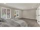 Bedroom features a large window with a view, tray with flowers, and carpet at 4339 Royal Pine Blvd, Indianapolis, IN 46250