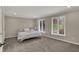 Bedroom features large windows, carpet, and neutral paint at 4339 Royal Pine Blvd, Indianapolis, IN 46250