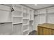 Walk-in closet featuring custom shelves and rods for optimal storage and organization at 4339 Royal Pine Blvd, Indianapolis, IN 46250