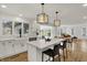 Bright kitchen with stainless steel appliances, undermount sink, hardwood floors, and an adjacent dining area at 4339 Royal Pine Blvd, Indianapolis, IN 46250