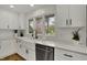 Bright kitchen with white cabinets, stainless steel appliances, undermount sink, and granite countertops at 4339 Royal Pine Blvd, Indianapolis, IN 46250