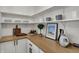 Charming kitchen boasts sleek butcher block countertops, white cabinets, and modern decor at 4339 Royal Pine Blvd, Indianapolis, IN 46250