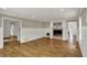 Inviting living room with a decorative fireplace, hardwood floors, and neutral wall paint for a cozy and comfortable space at 4339 Royal Pine Blvd, Indianapolis, IN 46250