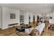 Spacious open-concept living room with modern decor, hardwood floors, and seamlessly connected spaces for comfortable living at 4339 Royal Pine Blvd, Indianapolis, IN 46250