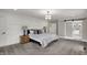 Spacious main bedroom features stylish wainscoting and an en suite bathroom with sliding barn door at 4339 Royal Pine Blvd, Indianapolis, IN 46250
