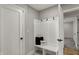 A beautifully designed mudroom with a bench and coat hooks provides convenient storage and organization at 4339 Royal Pine Blvd, Indianapolis, IN 46250