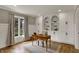 Bright home office with custom shelving, a large window, and hardwood floors for a productive workspace at 4339 Royal Pine Blvd, Indianapolis, IN 46250
