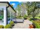 Outdoor patio featuring seating and view of the two-story home with mature trees at 4339 Royal Pine Blvd, Indianapolis, IN 46250