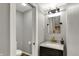 Updated powder room with dark vanity cabinet, marble countertop and gold fixtures at 4339 Royal Pine Blvd, Indianapolis, IN 46250