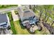 Aerial view of a home with a sprawling backyard featuring a patio and lush landscaping at 4410 Miller Way, Westfield, IN 46062