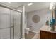 Modern bathroom with glass shower, white cabinetry, neutral decor, and stylish mirror at 4410 Miller Way, Westfield, IN 46062