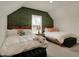 Bedroom featuring two beds, a green accent wall, and natural light at 4410 Miller Way, Westfield, IN 46062